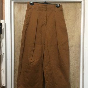 New without tags Babaton The Group size 4 rust color 22" inseam, wide leg